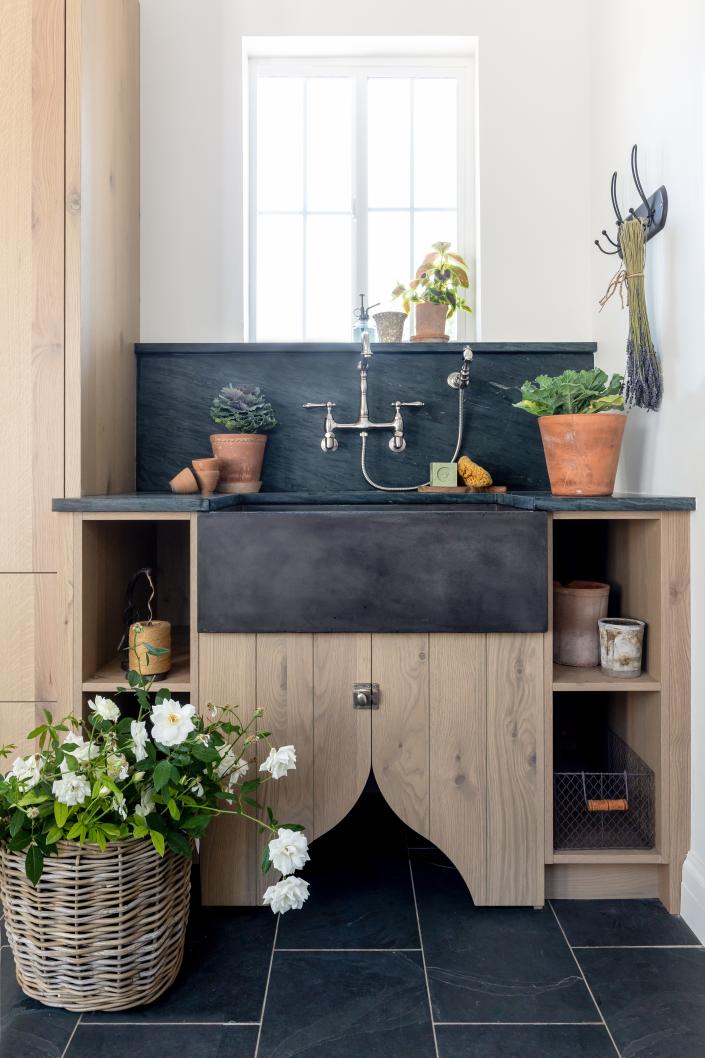 In this sink by House of Jade, rustic elements like aged pots and twine complement modern finishes.