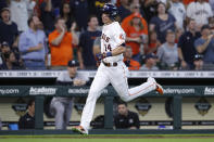 Houston Astros' Mauricio Dubon runs home to score on an RBI double by Korey Lee during the second inning in the first game of a baseball doubleheader against the New York Yankees Thursday, July 21, 2022, in Houston. (AP Photo/Kevin M. Cox)