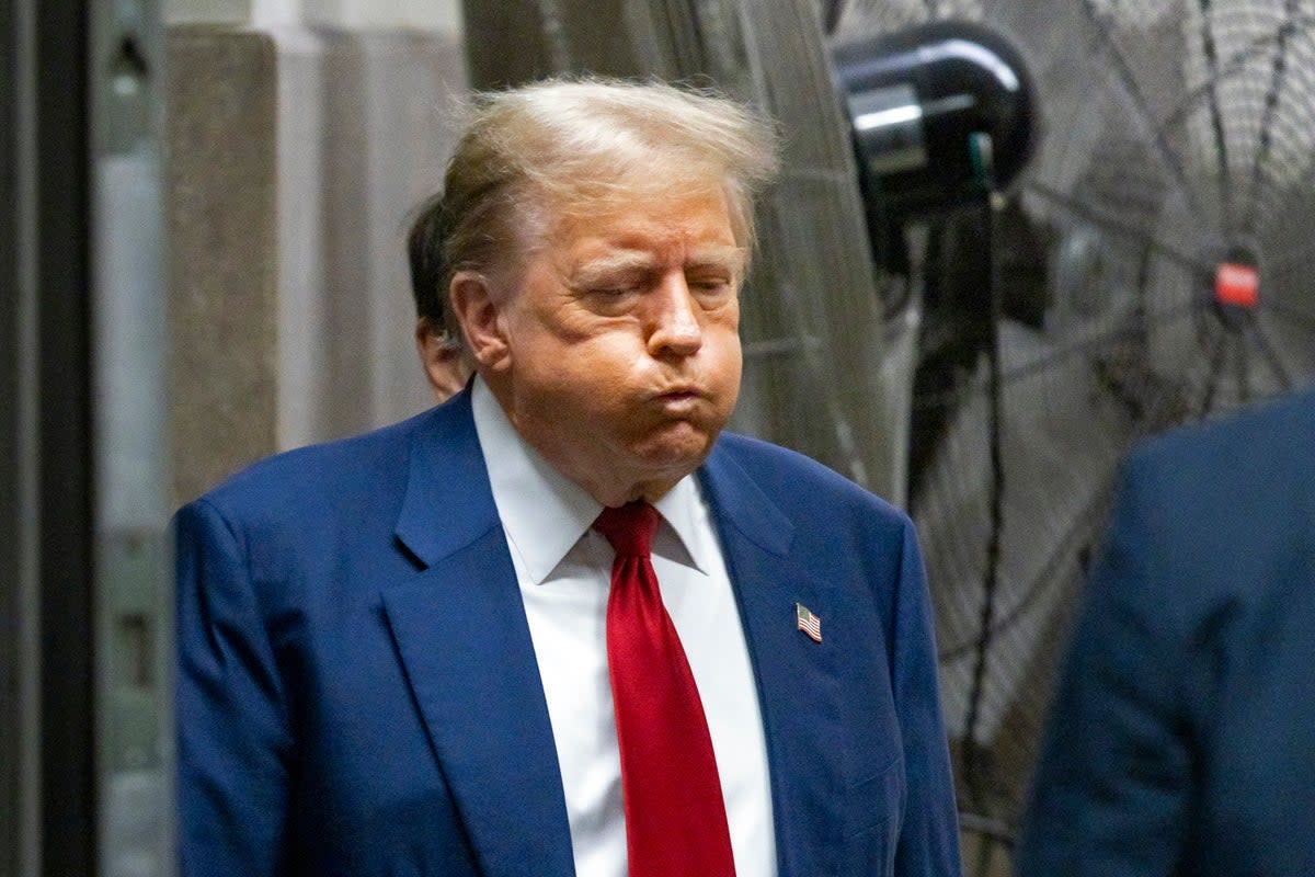 Donald Trump leaving the courtroom at his trial on 30 April  (AP)