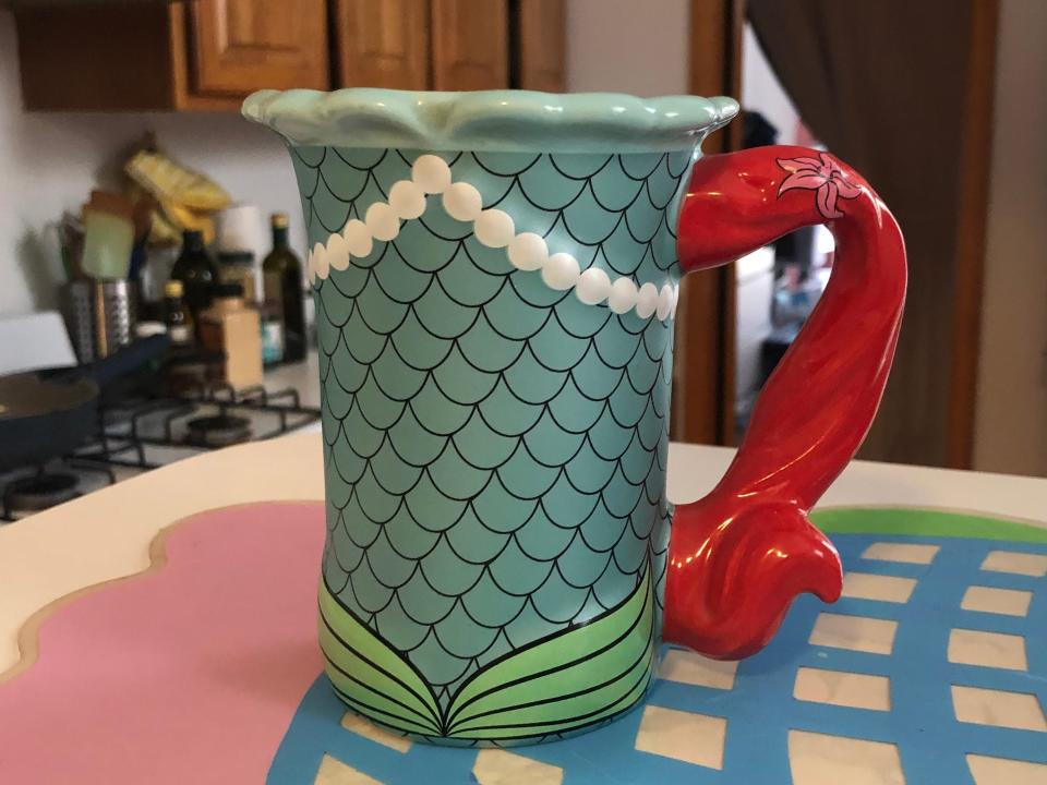 princess ariel coffee mug on a kitchen counter