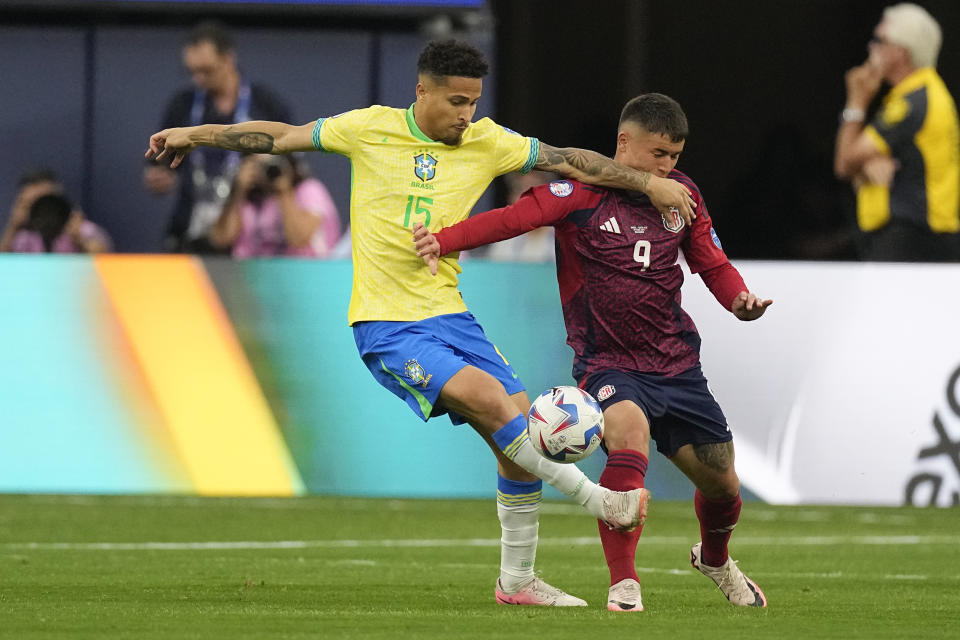 Brazil's Joao Gomes, left, controls the ball next to Costa Rica's Manfred Ugalde during a Copa America Group D soccer match Monday, June 24, 2024, in Inglewood, Calif. (AP Photo/Mark J. Terrill)