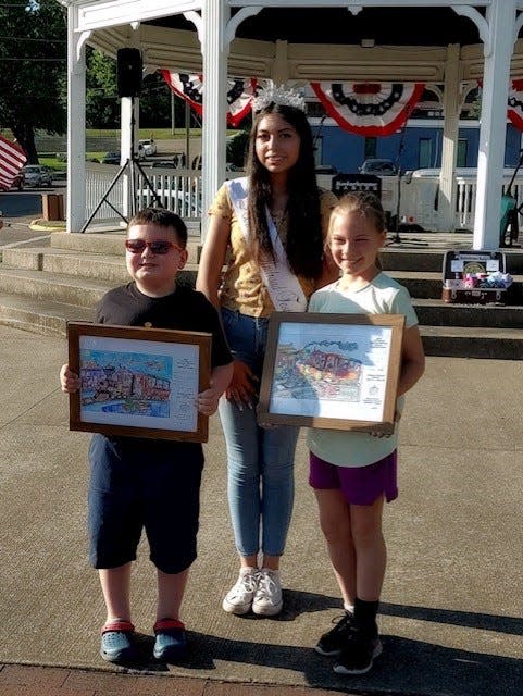 Winners of the Dennison Railroad Festival's coloring contest were Kaden
LeMonte and Veronica Ott, both third graders at the Immaculate Conception
School. They are shown with festival Queen Maria Castro-Lux, who
was crowned Wednesday evening. Photo courtesy of Dennison Railroad Festival Committee.