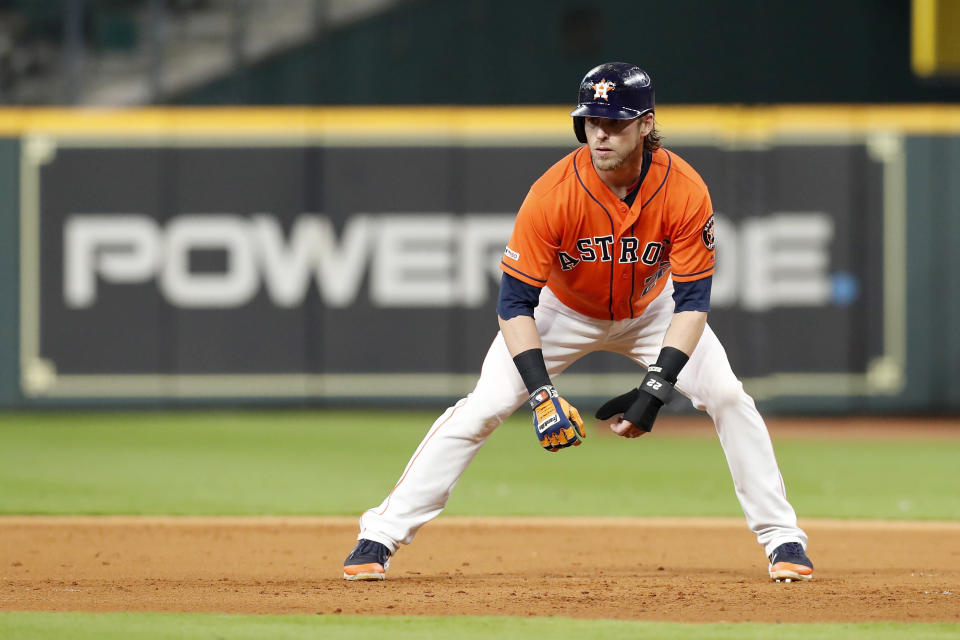 HOUSTON, TX - MAY 10:  Josh Reddick #22 of the Houston Astros takes a lead off first base in the second inning against the Texas Rangers at Minute Maid Park on May 10, 2019 in Houston, Texas.  (Photo by Tim Warner/Getty Images)