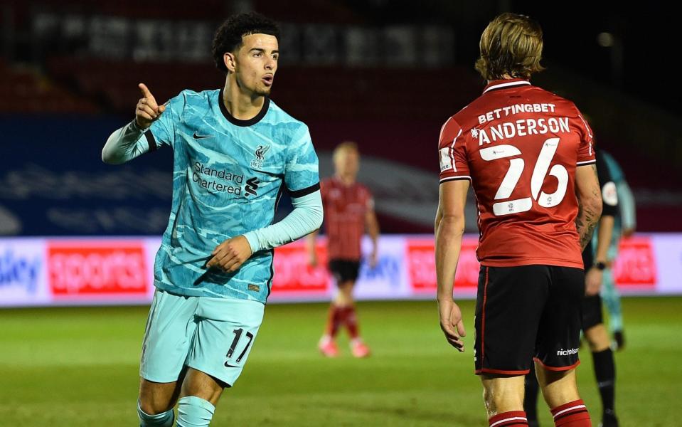 Liverpools Curtis jones Scores the forth goal and makes it 0-4 and celebrates During the Carabao Cup third round match between Lincoln City and Liverpool at Sincil Bank Stadium on September 24, 2020 in Lincoln, England.  - GETTY IMAGES