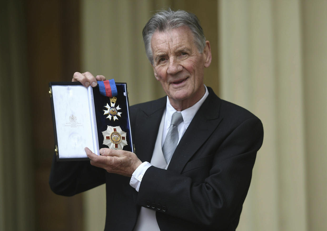 Michael Palin poses for a photo after he was made a Knight Commander of the Order of St Michael and St George by Prince William during an investiture ceremony at Buckingham Palace, London, Wednesday June 12, 2019. (David Mirzoeff Pool Photo via AP)