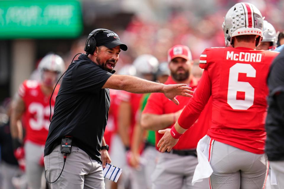 Sep 16, 2023; Columbus, Ohio, USA; Ohio State Buckeyes head coach Ryan Day high fives quarterback Kyle McCord (6) during the first half of the NCAA football game against the Western Kentucky Hilltoppers at Ohio Stadium.