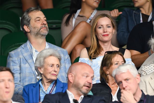 <p>Karwai Tang/WireImage</p> Judd Apatow and Leslie Mann at Wimbledon