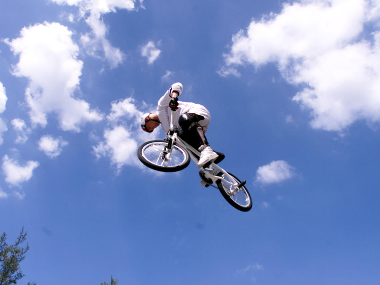 The freestyle rider held several titles during his life, including for landing a double flair and the longest power-assisted bicycle flip: Getty