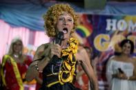 Street vendor and Golden Gays member Al Enriquez, 82, also known as "Carmen Dela Rue", introduces himself to the crowd during the Golden Gays of Manila Beauty Pageant