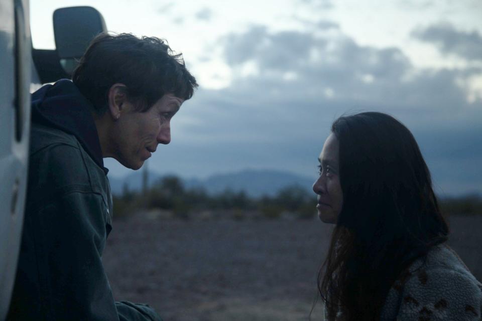 Director Chloé Zhao (right) chats with star Frances McDormand on the set of "Nomadland."