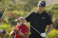 Jordan Spieth reaches for a club on the 11th hole during the first round of the PGA Championship golf tournament on the Ocean Course Thursday, May 20, 2021, in Kiawah Island, S.C. (AP Photo/Matt York)