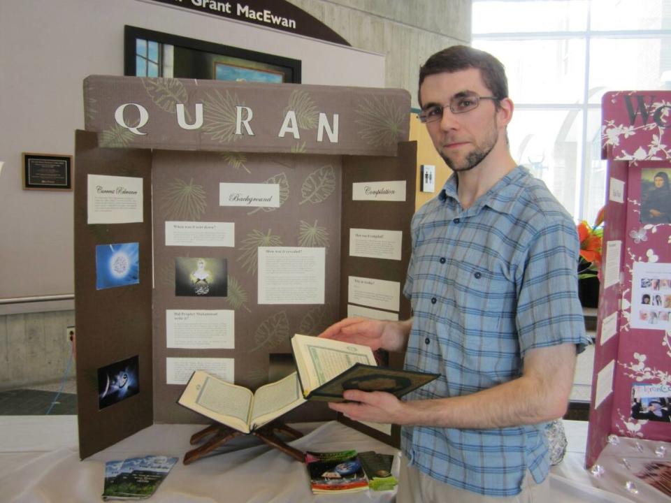 Aaron Wannamaker became Muslim in 2007. This is a photo of Wannamaker at a booth for the Muslim Students Organization at Grant MacEwan in 2011.  (Submitted by Aaron Wannamaker  - image credit)