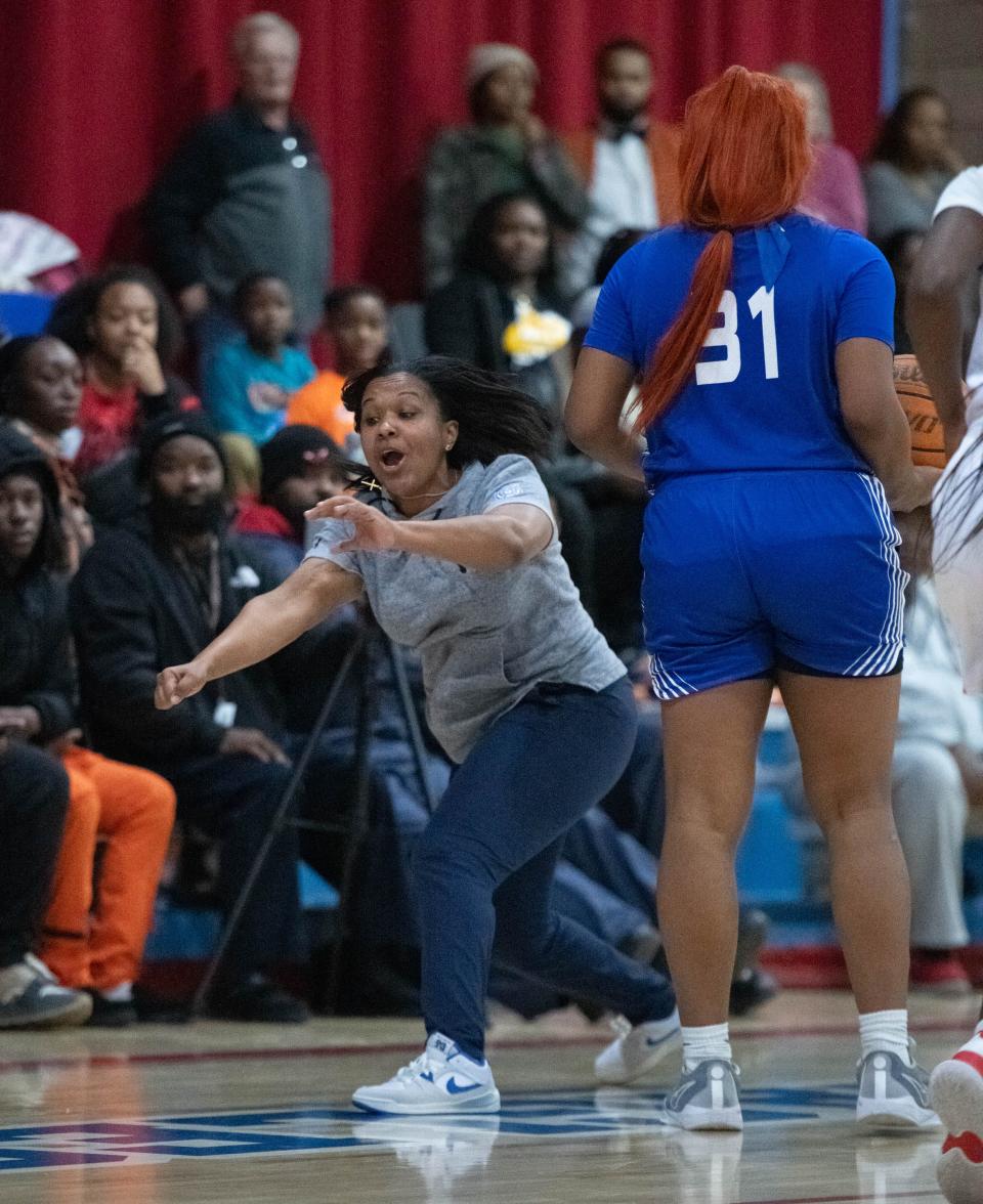 Wildcats head coach Jade Brown shouts to her players during lthe Washington vs Pine Forest girls basketball game at Pine Forest High School in Pensacola on Tuesday, Dec. 5, 2023.