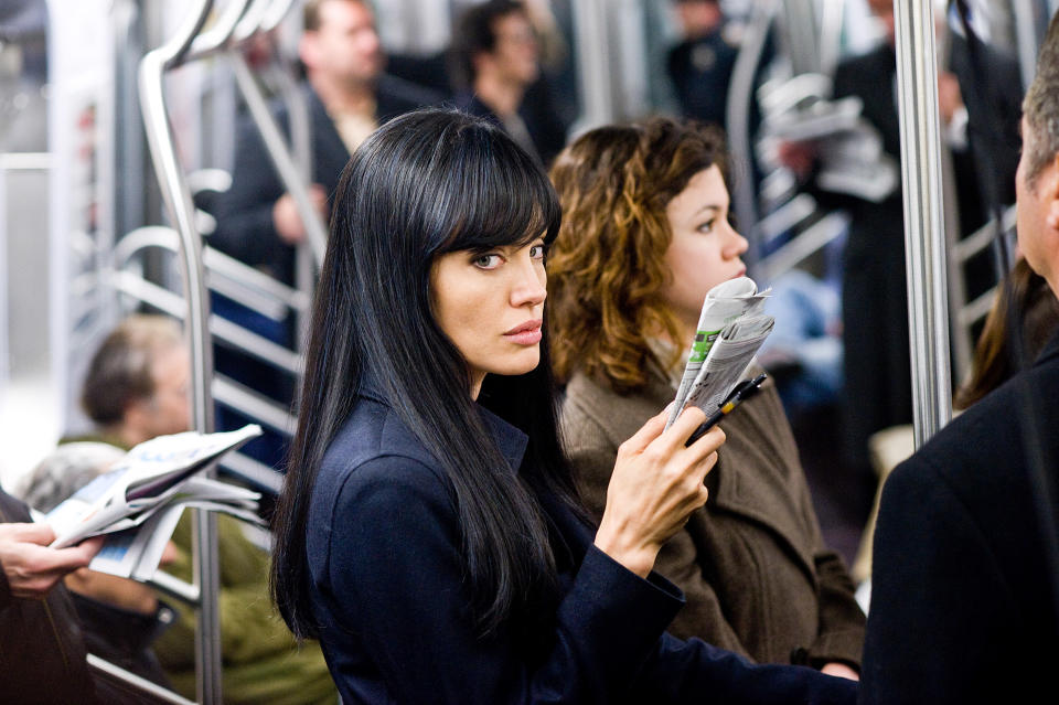 closeup of Angelina in a subway car as the character