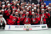 Canada poses with their gold medals during a ceremony after defeating Germany for the Ice Hockey World Championship in Tampere, Finland, Sunday, May 28, 2023. (AP Photo/Pavel Golovkin)