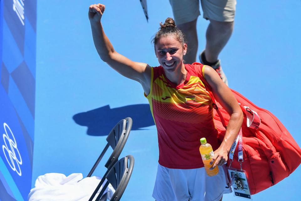 Spain's Sara Sorribes Tormo celebrates as she leaves the court after defeating Australia's Ashleigh Barty during their Tokyo 2020 Olympic Games women's singles first round tennis match at the Ariake Tennis Park in Tokyo on July 25, 2021. (Photo by Tiziana FABI / AFP) (Photo by TIZIANA FABI/AFP via Getty Images)