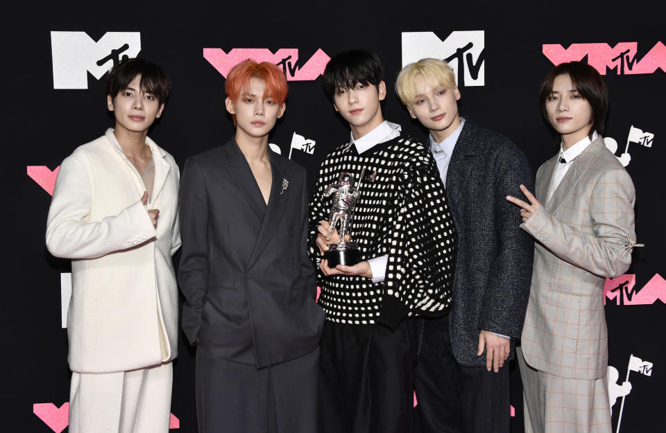 Tomorrow X Together, winners of the award for push performance of the year for "Sugar Rush Ride," arrive at the MTV Video Music Awards on Tuesday, Sept. 12, 2023, at the Prudential Center in Newark, N.J. (Photo by Evan Agostini/Invision/AP)