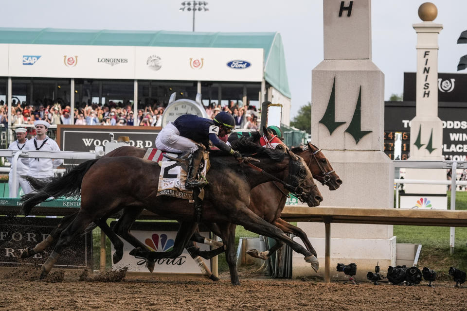 Sierra Leone with jockey Tyler Gaffalione (2), Forever Young with jockey Ryusei Sakai and Mystik Dan with jockey Brian Hernandez Jr., cross the finish line at Churchill Downs during the 150th running of the Kentucky Derby horse race, Saturday, May 4, 2024, in Louisville, Ky. (AP Photo/Kiichiro Sato)