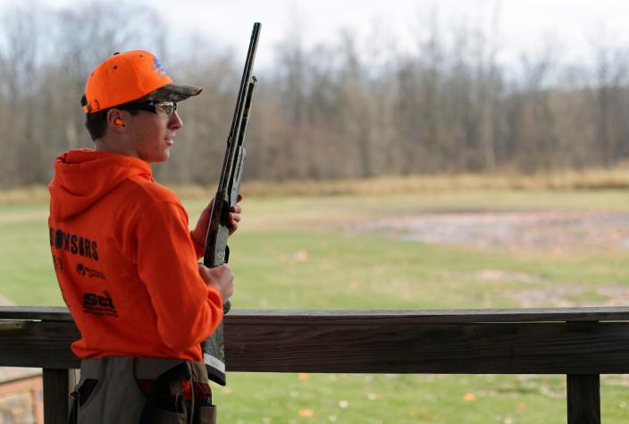 Random Lake High School student Natron Daggett, 16, waits for his turn during a session on skeet shooting at the Highlands Sportsmen's Club, Wednesday, November 9, 2022, in Cascade, Wis.