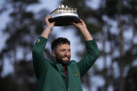 Jon Rahm, of Spain, holds up the trophy after winning the Masters golf tournament at Augusta National Golf Club on Sunday, April 9, 2023, in Augusta, Ga.(AP Photo/David J. Phillip)