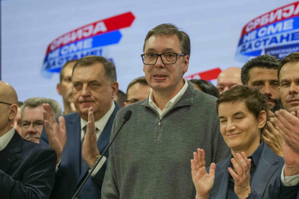 Serbian President Aleksandar Vucic grimaces during a press conference in his party headquarters after a parliamentary and local election in Belgrade, Serbia, Sunday, Dec. 17, 2023. Serbia's governing populists claimed a sweeping victory Sunday in the country's parliamentary election, which was marred by reports of major irregularities both during a tense campaign and on voting day. (AP Photo/Darko Vojinovic)
