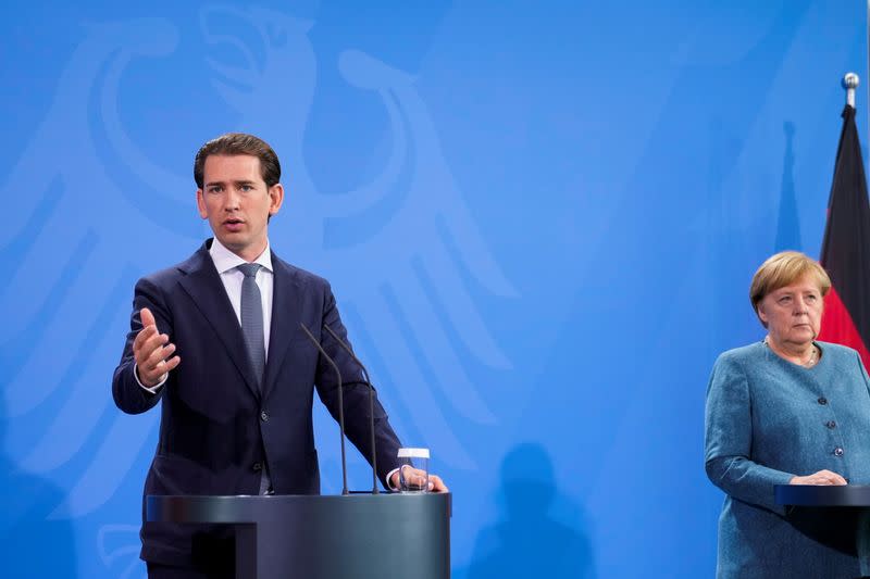 German Chancellor Angela Merkel and Austria's Chancellor Sebastian Kurz attend a news conference in Berlin