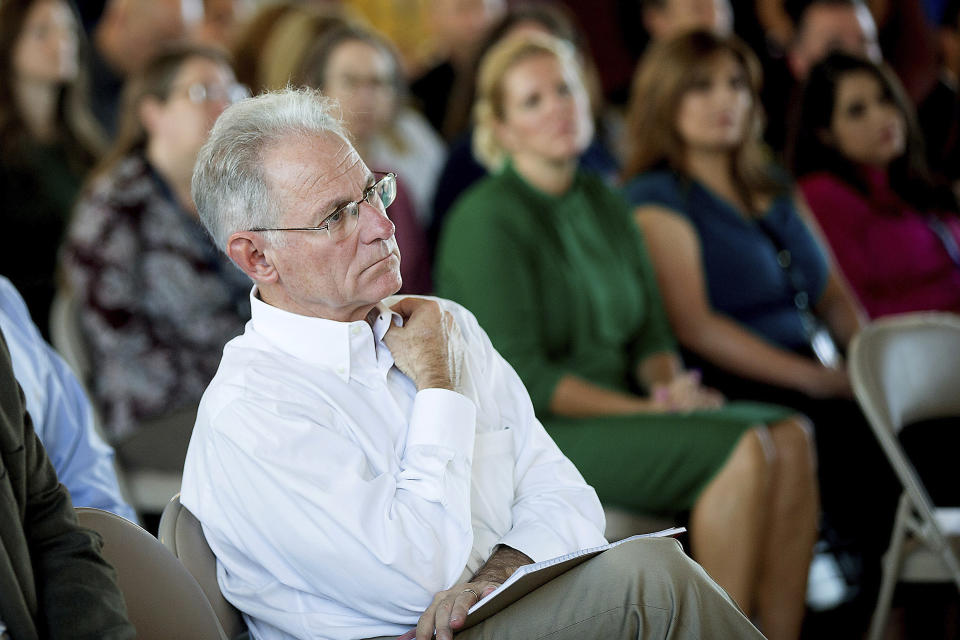 This photo taken Oct. 14, 2019, shows City of Tucson Mayor Jonathan Rothschild, center, listening to the new Tucson Fire Chief, Charles W. Ryan, III, give remarks during a badge pinning ceremony in Tucson, Ariz. Voters in Tucson will decide Tuesday, Nov. 5, whether to make the liberal enclave Arizona's only sanctuary city in an effort to confront President Donald Trump's immigration policies and the state's tough laws cracking down on people in the country illegally. (Mamta Popat/Arizona Daily Star via AP)