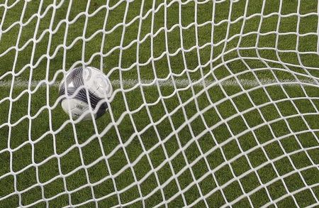 A soccer ball is seen in a net during the French Ligue 1 soccer match between Girondins Bordeaux and Racing Lens at the Chaban Delmas stadium in Bordeaux on August 9, 2009. REUTERS/Regis Duvignau