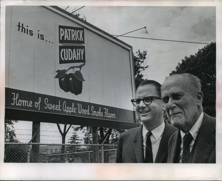 1967. Richard Cudahy and his father, Michael F., posed in front of a sign outside the offices of Patrick Cudahy, Inc. in 1967. The sign bears the company&#39;s slogan.