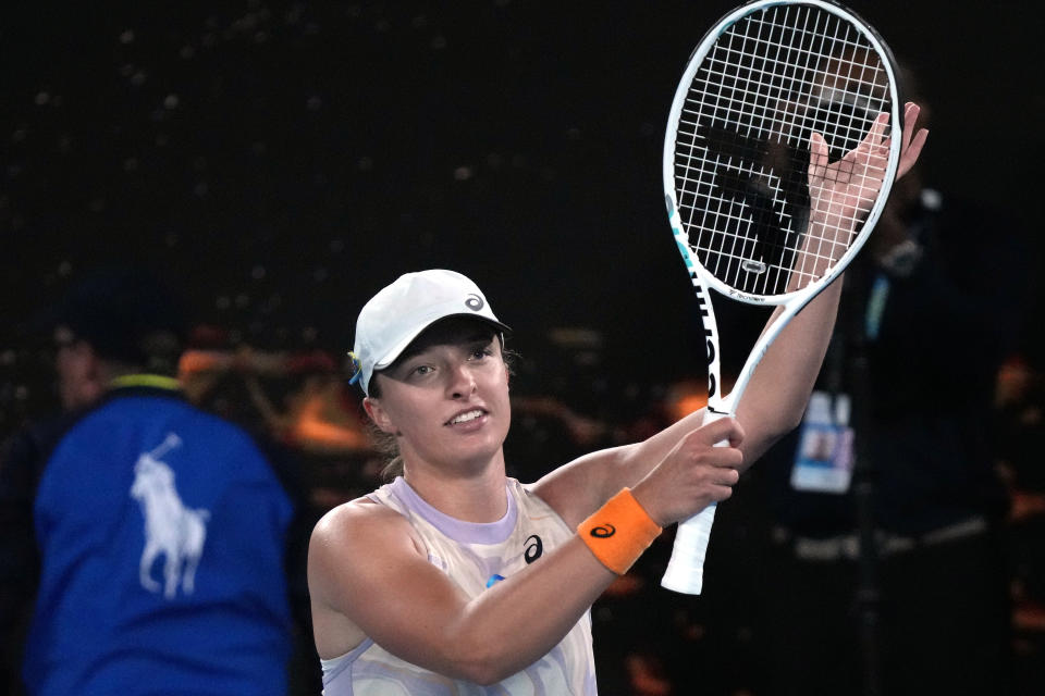 Iga Swiatek of Poland celebrates after defeating Camila Osorio of Colombia in their second round match at the Australian Open tennis championship in Melbourne, Australia, Wednesday, Jan. 18, 2023. (AP Photo/Dita Alangkara)