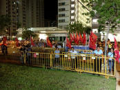 Volunteers with the Workers' Party look on at the rally grounds. (Yahoo! photo)