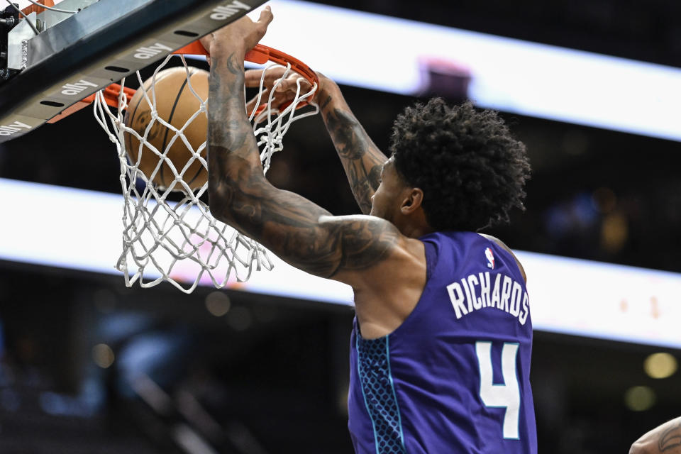 Charlotte Hornets center Nick Richards (4) goes up for a slam dunk during the first half of an NBA basketball game against the Orlando Magic, Tuesday, March 5, 2024, in Charlotte, N.C. (AP Photo/Matt Kelley)