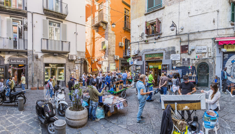 The busy corner with street vendors between Via San Gregorio Armeno and Via San Biagio dei Librai in Naples