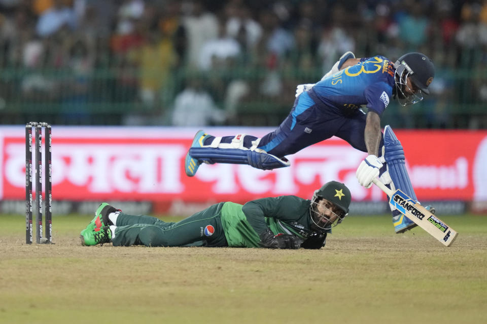 Pakistan's wicketkeeper Mohammad Rizwan misses a ball as Sri Lanka's Kusal Mendis completes a run during the Asia Cup cricket match between Pakistan and Sri Lanka in Colombo, Sri Lanka on Thursday, Sept.14, 2023. (AP Photo/Eranga Jayawardena)