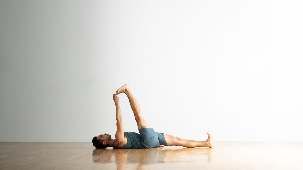 8 Common Yoga Poses You Can Practice While Lying on Your Back (Yes, Really)