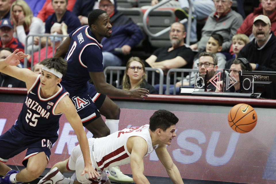 Arizona guards Kerr Kriisa, front left, and Courtney Ramey and Washington State guard Dylan Darling chase the ball as it goes out of bounds during the second half of an NCAA college basketball game Thursday, Jan. 26, 2023, in Pullman, Wash. Arizona won 63-58. (AP Photo/Young Kwak)