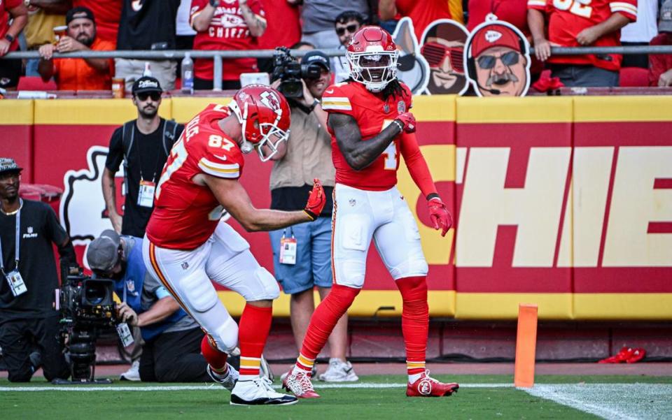 Kansas City Chiefs tight end Travis Kelce (87) bows to wide receiver Rashee Rice (4) after Rice ran in a touchdown on a reception in the second quarter against the Cincinnati Bengals Sunday, Sept. 15, 2024, at GEHA Field at Arrowhead Stadium.