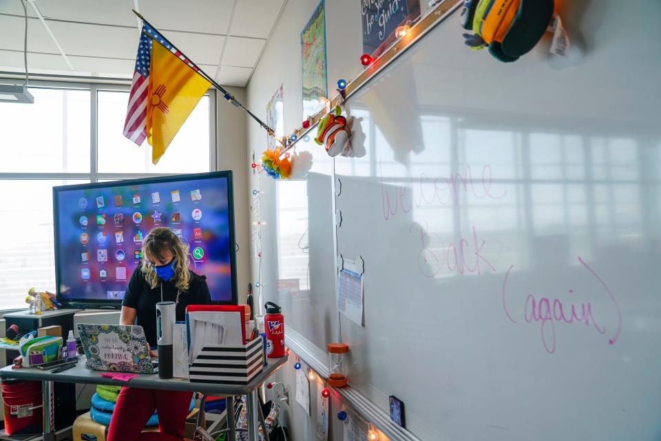 West Mesa High School teacher Stephanie Davy prepares for class on the second day of in-person instruction at West Mesa High School.