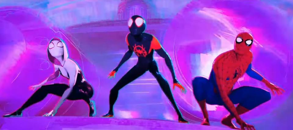 Gwen, Miles, and Peter wearing their Spider-Man suits inside Kingpin's supercollider in "Spider-Man: Into the Spider Verse"