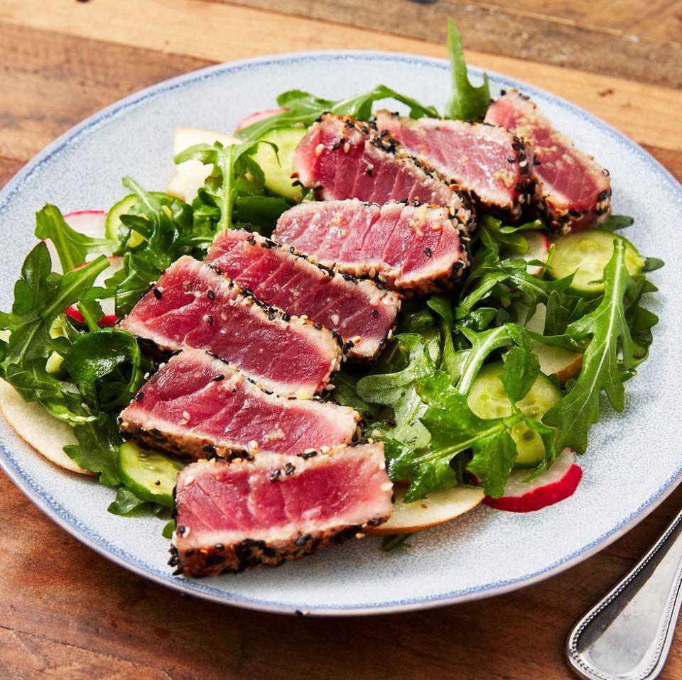 <p>Turns out searing your own Ahi tuna at home is easy and <em>way</em> cheaper than that pricey Poke place. Peppery arugula and sweet pear bring tons of flavor to the tender fish.</p><p><em><a href="https://www.delish.com/cooking/recipe-ideas/a26554658/seared-ahi-tuna-steak-recipe/" rel="nofollow noopener" target="_blank" data-ylk="slk:Get the recipe from Delish »;elm:context_link;itc:0;sec:content-canvas" class="link ">Get the recipe from Delish »</a></em></p>