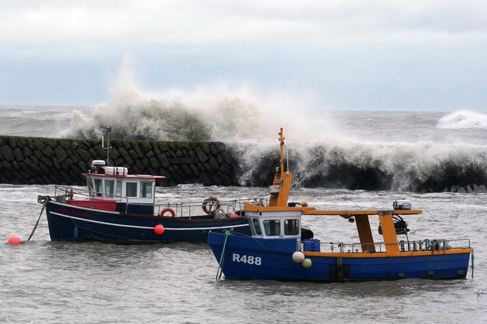 Waves crash behind fishing boats at Folkestone harbour, Ken (Gareth Fuller/PA Wire)