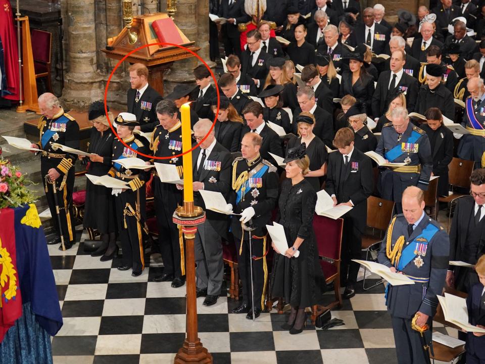 circle around harry and Meghan sitting in the second row of the queen's funeral