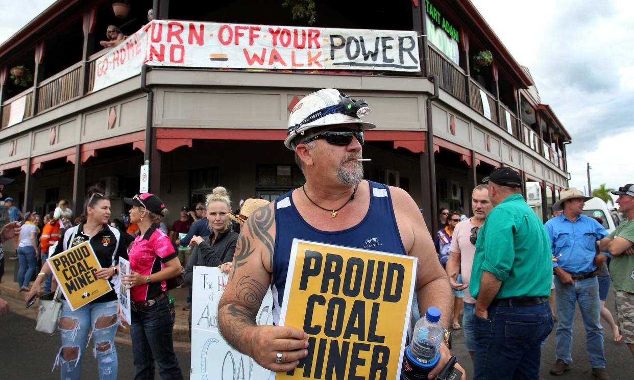 <span>Clermont locals and pro-Adani supporters protest against anti-Adani environment activists as they arrive by convoy on April 27, 2019.</span><span>Photograph: Lisa Maree Williams/Getty Images</span>