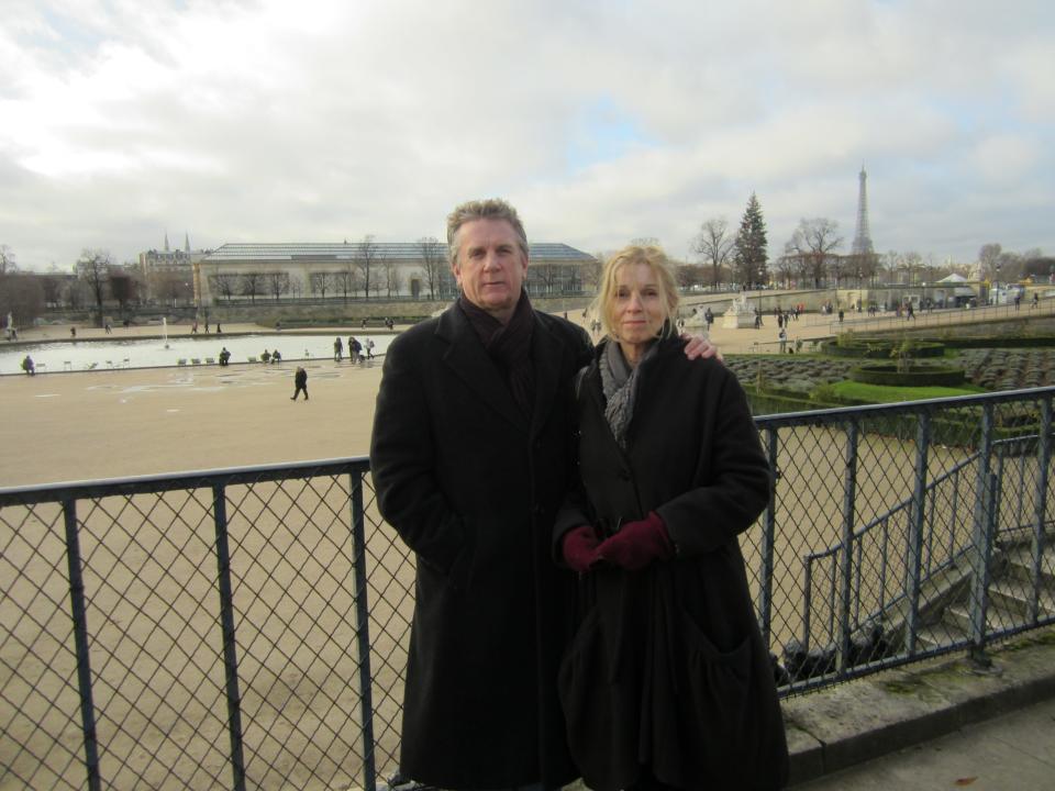 A man and woman in a park in Paris