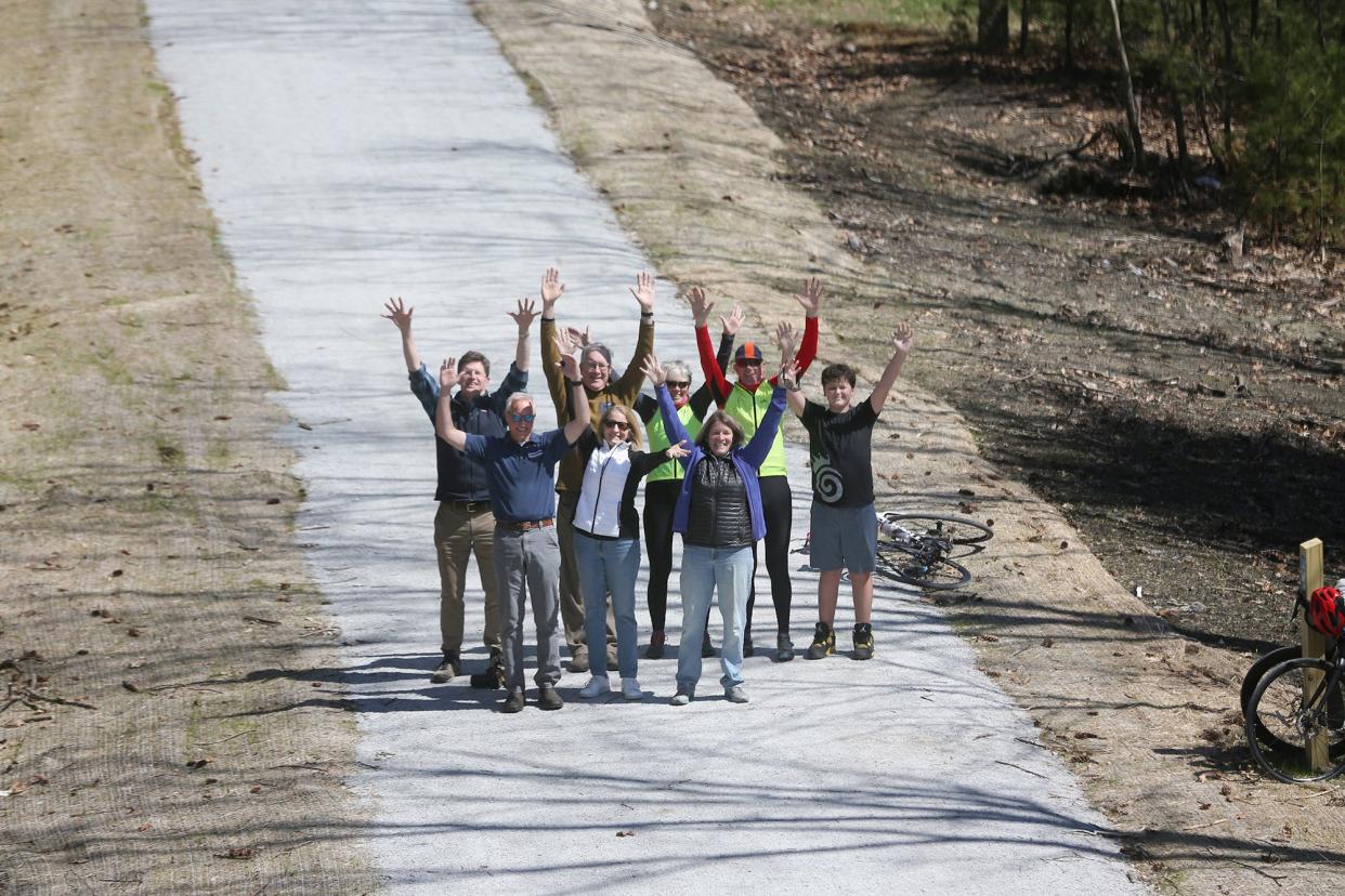 Members of the The New Hamphire Seacoast Greenway in Portsmouth are proud to show off the stretch that many bikers and pedestrians are already using. From left are Scott Bogle, Clark James, Jeff Latimer, Paula Rais, Sue Allen (back row), Sally Baybutt, Dave Allen and Reid Perkins.