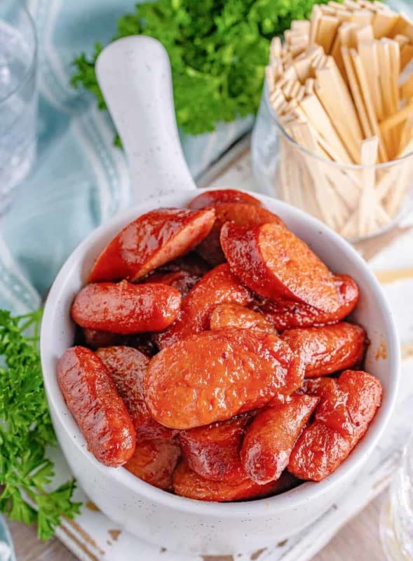 <p>The Country Cook</p><p>Look what canned cranberry sauce and grape jelly can do!</p><p><strong>Get the recipe: <a href="https://www.thecountrycook.net/crock-pot-glazed-sausages/" rel="nofollow noopener" target="_blank" data-ylk="slk:Crock Pot Glazed Sausages;elm:context_link;itc:0;sec:content-canvas" class="link rapid-noclick-resp">Crock Pot Glazed Sausages</a></strong></p>