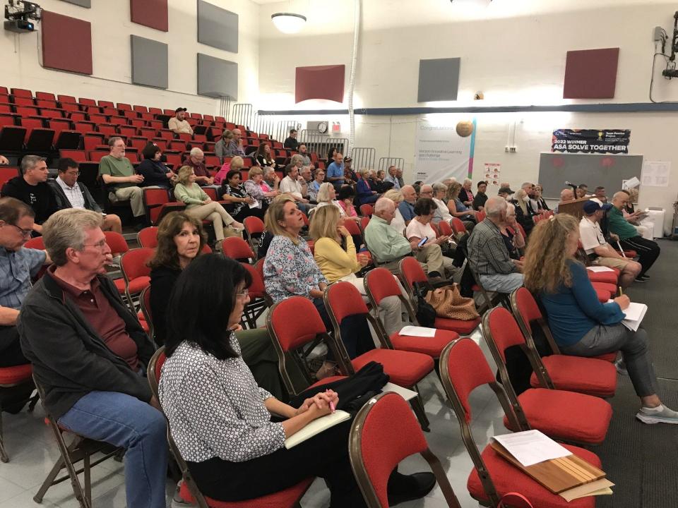 Audience members listen to testimony on Cigna development at Franklin Avenue Middle School in Franklin Lakes on Thursday.