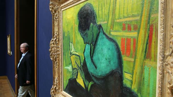 PHOTO: A man walks past Vincent Van Gogh's 'Une liseuse de romans,' valued at 2.5 to 3.5 million pounds, during a preview of Christie's Impressionist and Modern Art sale in London, June 17, 2005. (Odd Andersen/AFP via Getty Images, FILE)