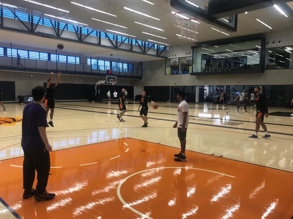 Frank Jackson takes a shot during practice at Suns training camp during a 3-point shooting drill with Duane Washington Jr. (middle left) and Timothe Luwawu-Cabarrot (far right) on Sept. 30, 2022.