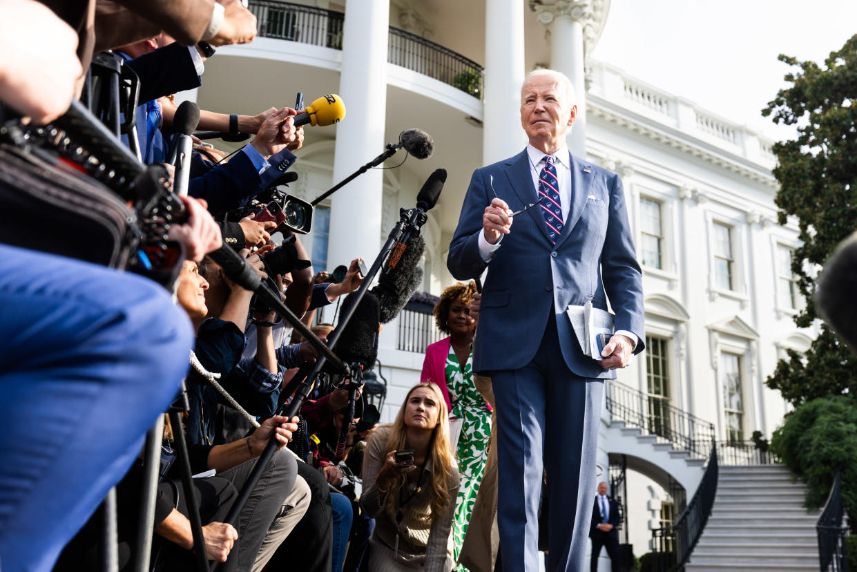 President Biden speaks to members of the media on the South Lawn of the White House.